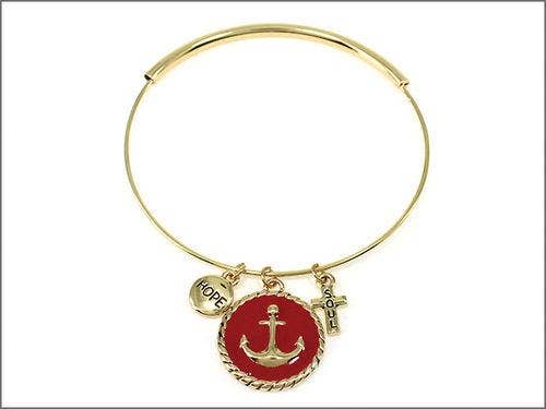 Gold bracelet with a red charm featuring an anchor and text on a white background