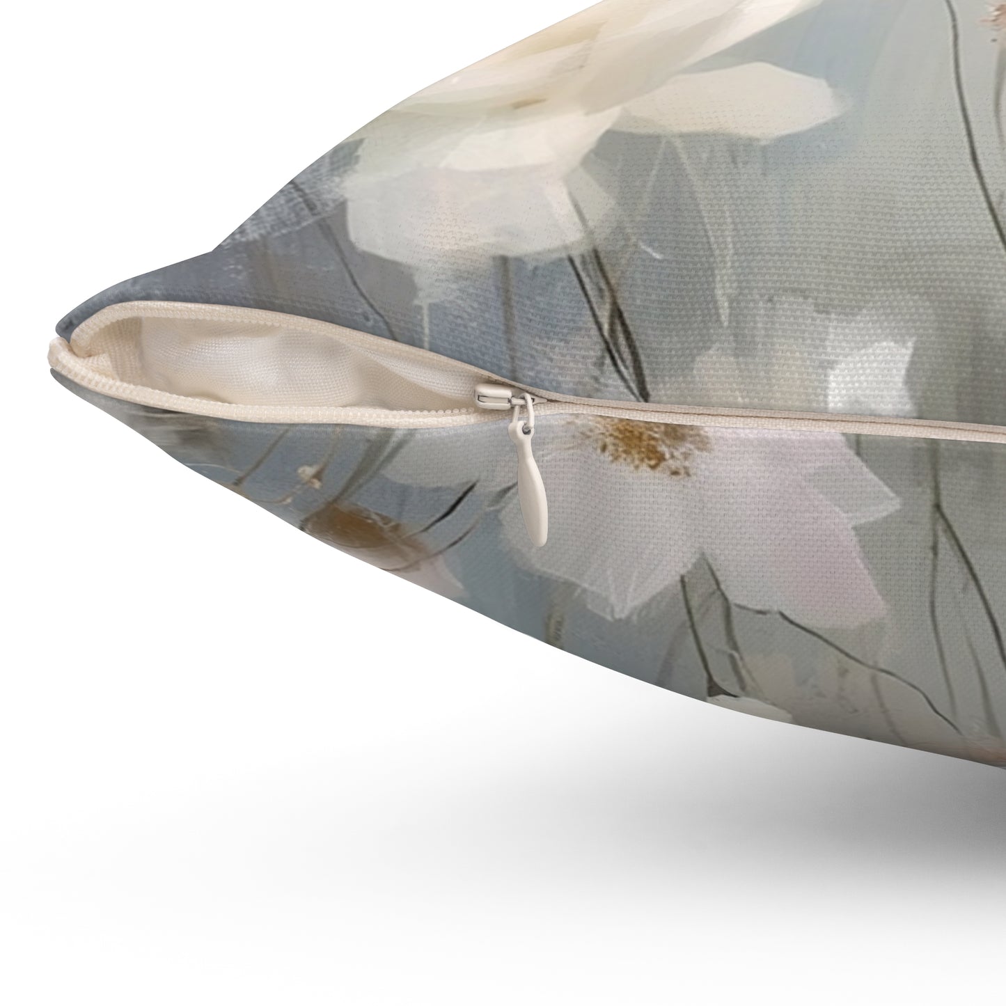 Floral-patterned pillow with zipper on a white background
