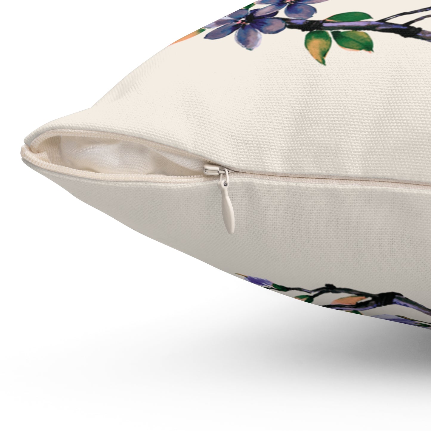 Floral-patterned pillow with a zipper on a white background