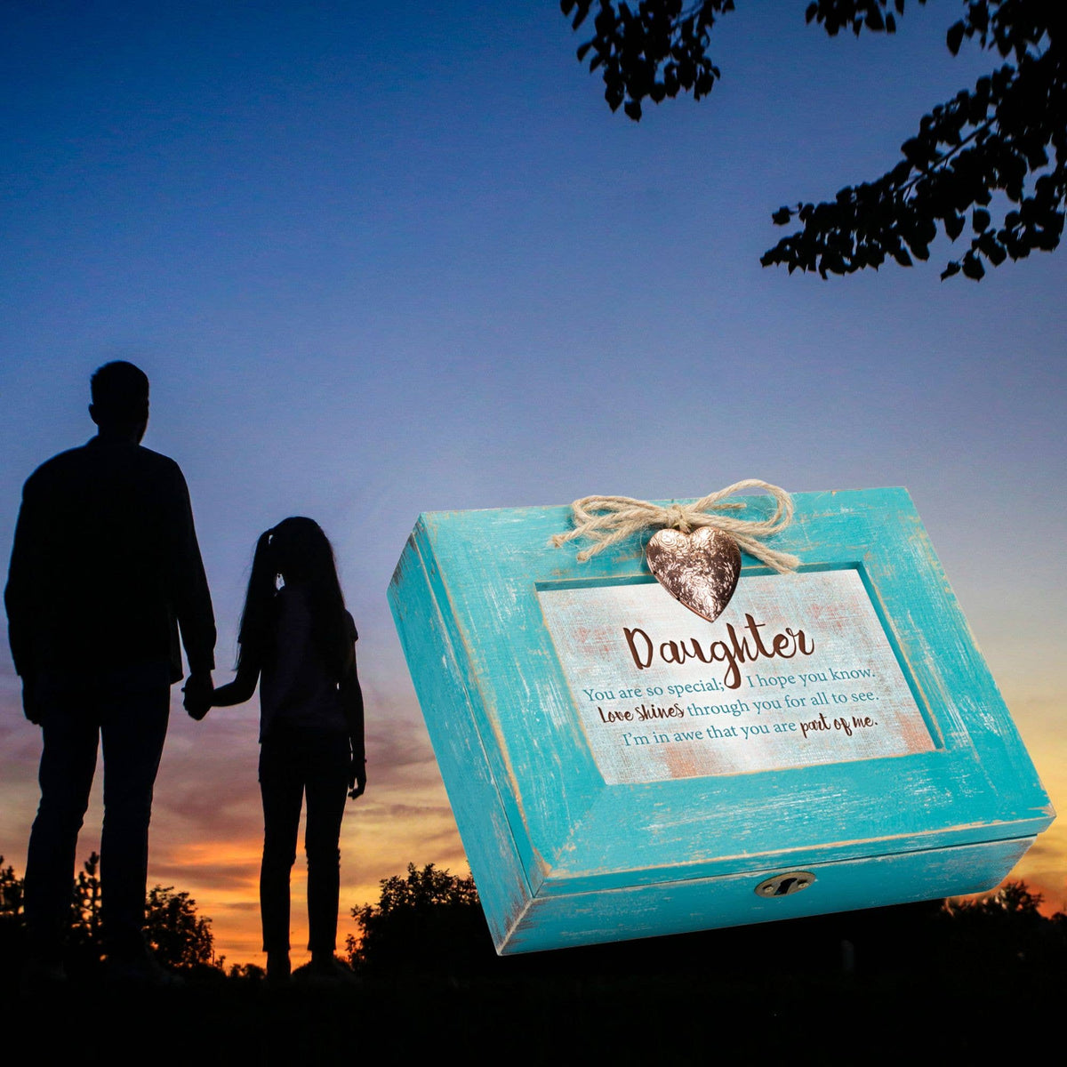 Turquoise jewelry box with 'Daughter' message against a sunset silhouette of a couple