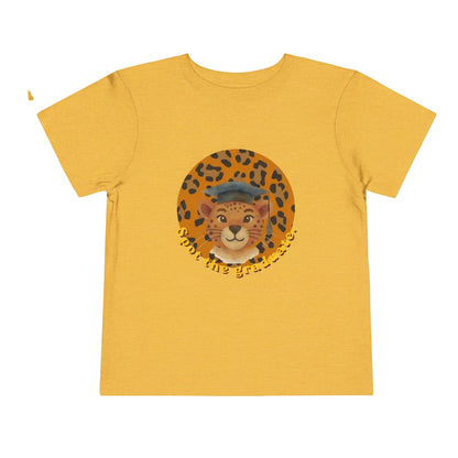 Yellow gold  t-shirt with a graphic of a cat wearing a graduation cap on a white background