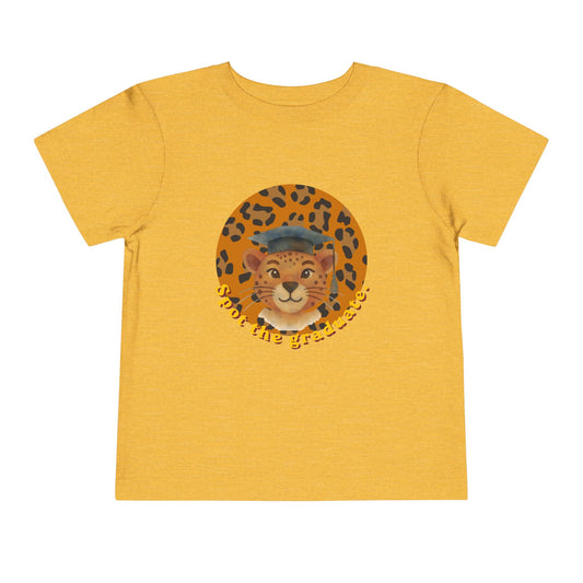 Yellow gold  t-shirt with a graphic of a cat wearing a graduation cap on a white background