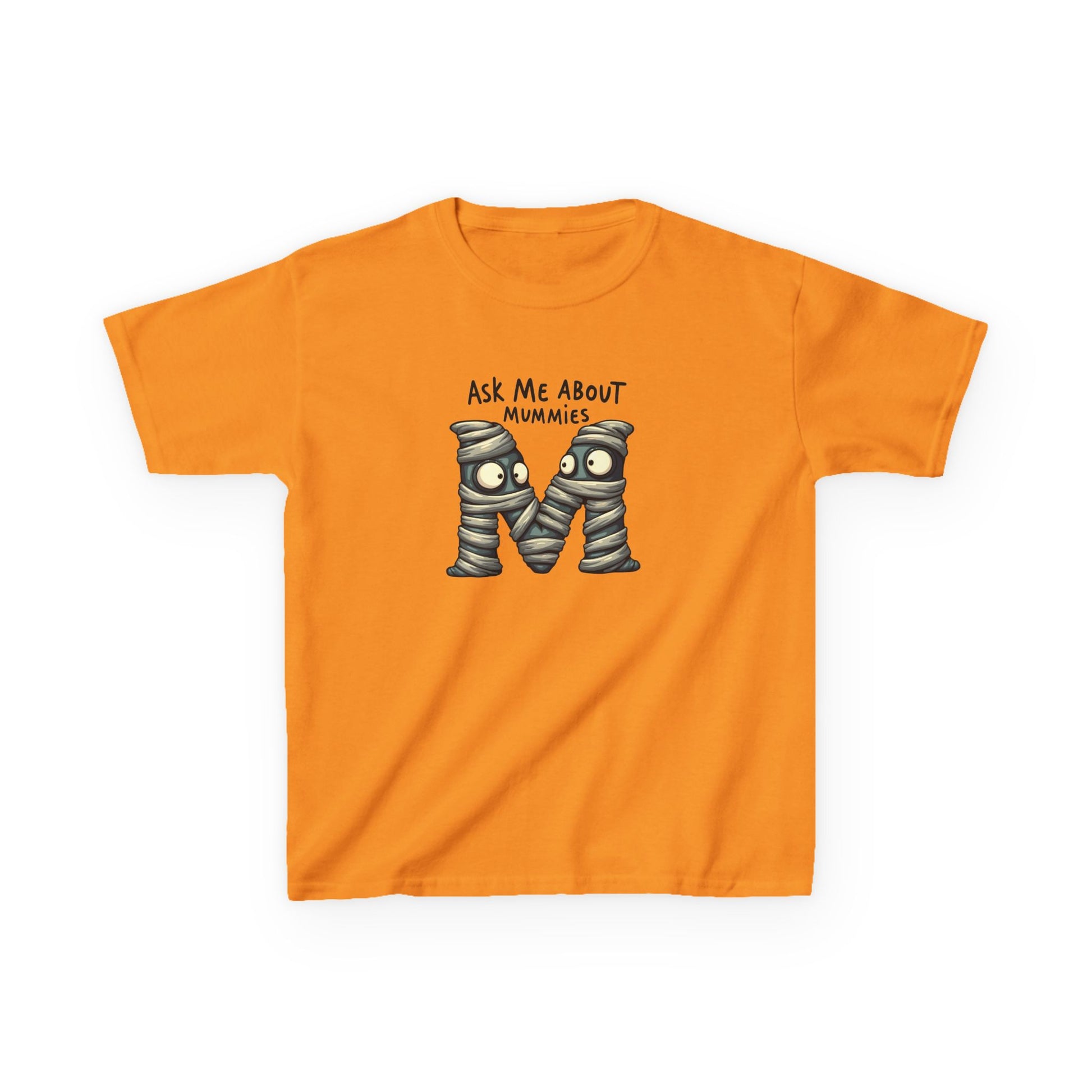 Kids history-themed shirt with “Ask Me About Mummies” design featuring cartoon mummy lettering on a Gildan 5000B Heavy Cotton Tee. Tennessee Orange