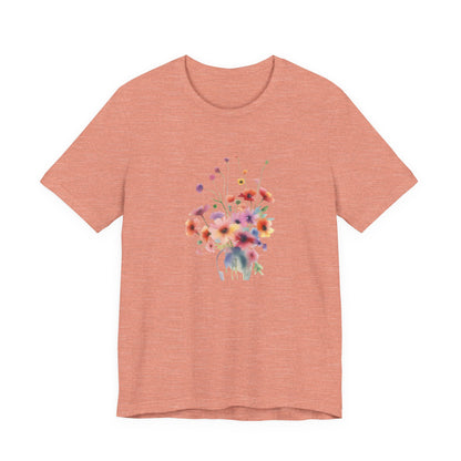 Pink t-shirt with a colorful floral design on a white background