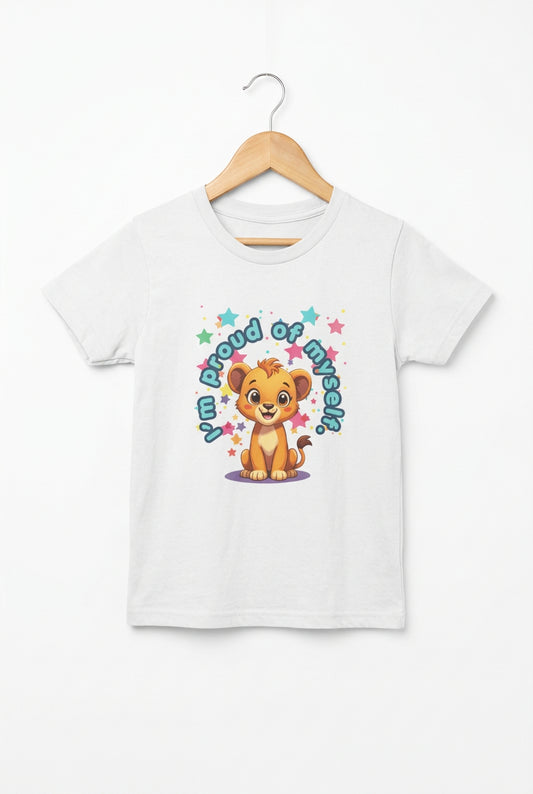 Kids’ ‘I’m Proud of Myself’ affirmation tee shown in a cozy home setting with a smiling lion cub graphic encouraging confidence and self‑esteem. White t-shirt with a cartoon lion and text on a white background.