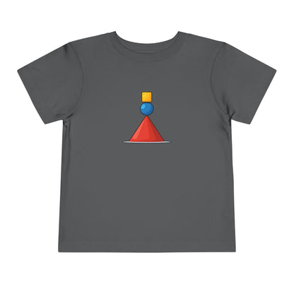 A dark gray short-sleeve t-shirt with a small geometric graphic on the chest featuring a red cone, a blue sphere, and a yellow cube.