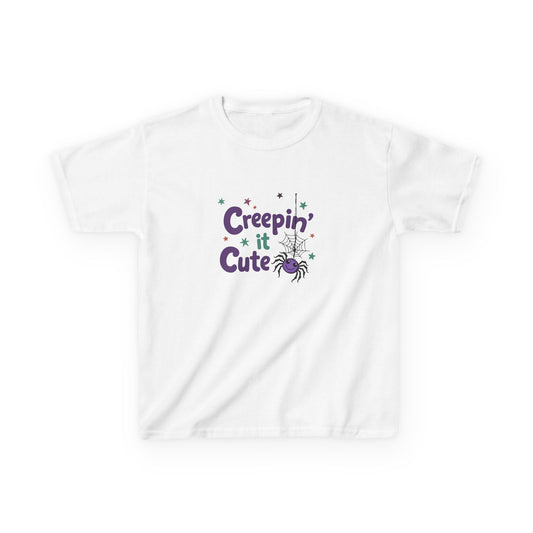 Kids Halloween shirt with “Creepin’ It Cute” design featuring colorful lettering and a friendly spider on a Gildan 5000B Heavy Cotton Tee.