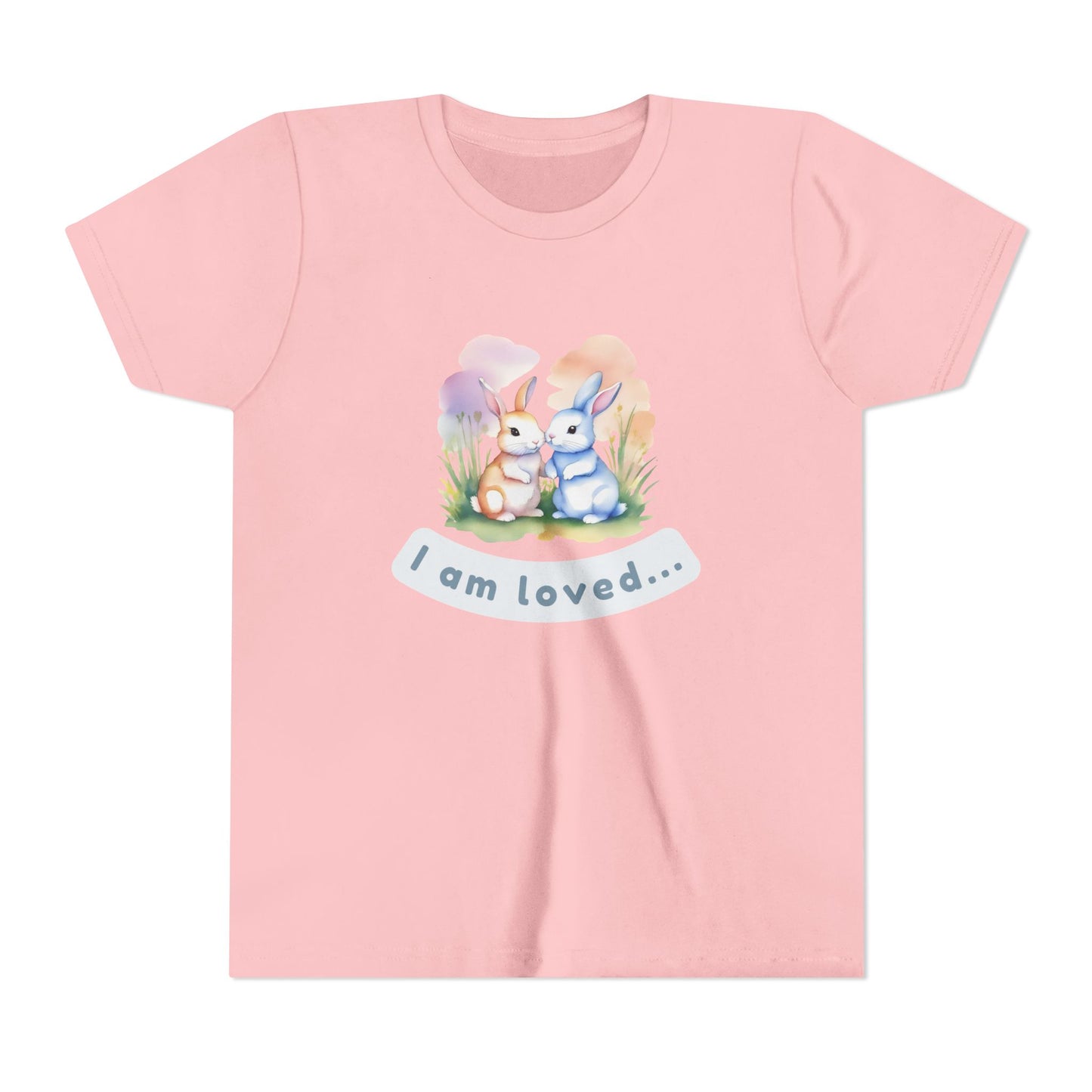 Pink t-shirt with cartoon bunnies and 'I am loved' text on a white background