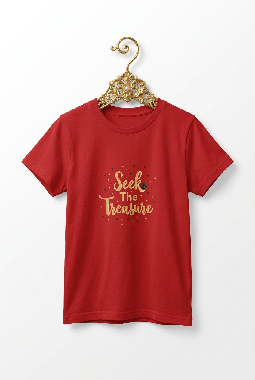 Kids red T‑shirt with golden “Seek the Treasure” lettering surrounded by small star accents.