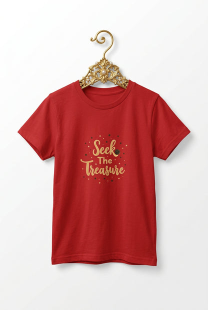 Kids red T‑shirt with golden “Seek the Treasure” lettering surrounded by small star accents.