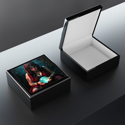 Wooden box with a colorful design of a woman holding a blue globe on a wooden surface. One box open showing the inside of the jewlery box.