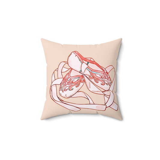 Decorative pillow with a stylized illustration of a ballet slipper on a beige background