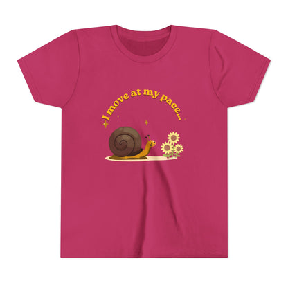 Pink t-shirt with a snail and flowers graphic and text on a white background