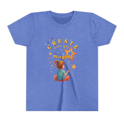 Blue t-shirt with a child drawing a star and 'Create your own magic' text on a white background