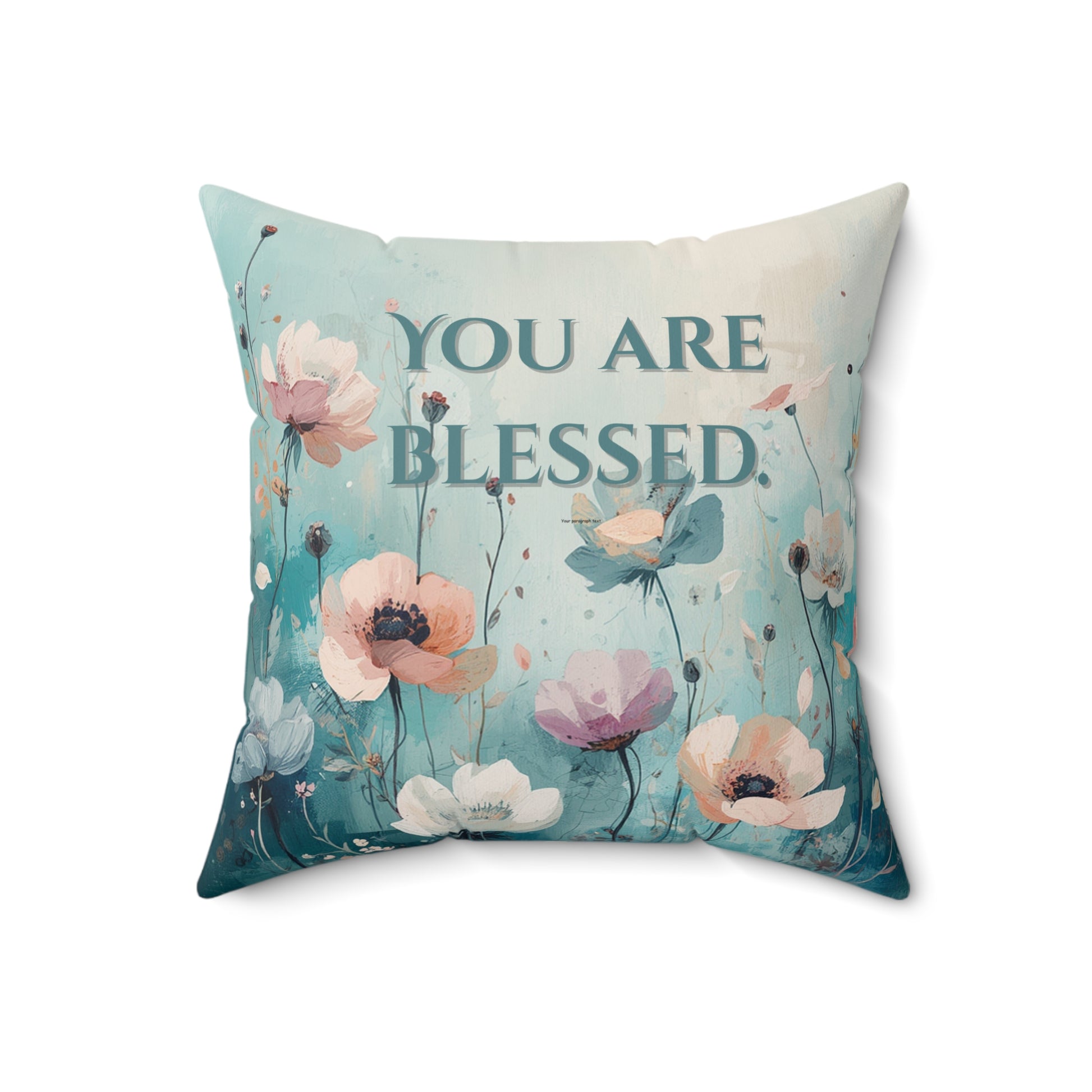 Decorative pillow with floral design and 'You are Blessed' text on a white background
