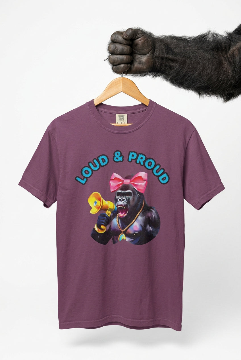 “Girl‑Girl™ cheerleader gorilla with pink bow and megaphone on a white unisex tee with the phrase ‘Loud & Proud.’”