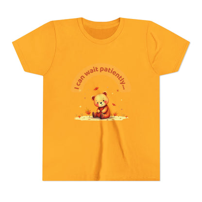 Orange t-shirt with a teddy bear graphic and text on a white background