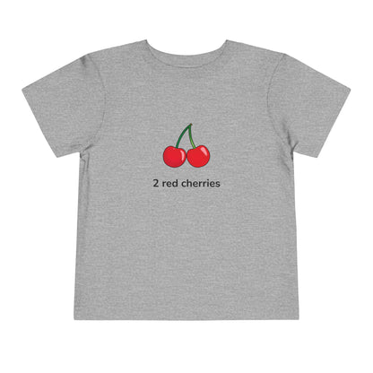 A heather gray short-sleeve t-shirt featuring a graphic of two red cherries with green stems and the text '2 red cherries' printed below, displayed on a solid white background.