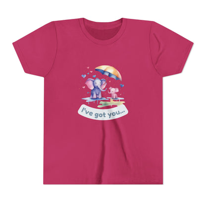 Pink t-shirt with cartoon design of an elephant and dog under an umbrella, text 'I've got you...', on a white background.