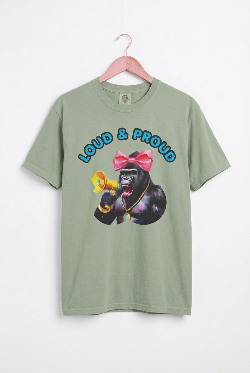 “Girl‑Girl™ cheerleader gorilla with pink bow and megaphone on a bay unisex tee with the phrase ‘Loud & Proud.’”