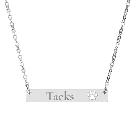 Silver necklace with a bar pendant and cross charm on a white background






