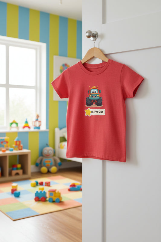 A heather red short-sleeve t-shirt with a cartoon graphic of a monster truck named Gus and a speech bubble that reads 'Hi, I'm Gus'.