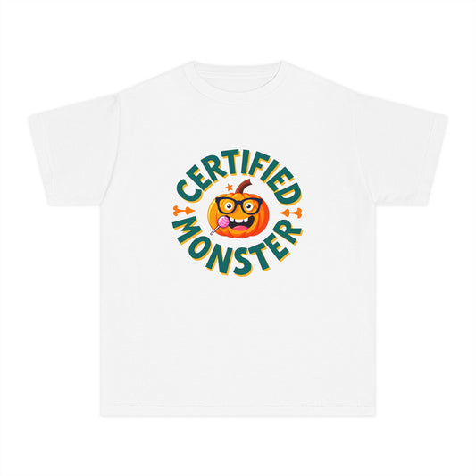 A white short-sleeve crewneck t-shirt featuring a colorful graphic on the chest with the text 'CERTIFIED MONSTER' in green and orange around a cartoon orange pumpkin character.