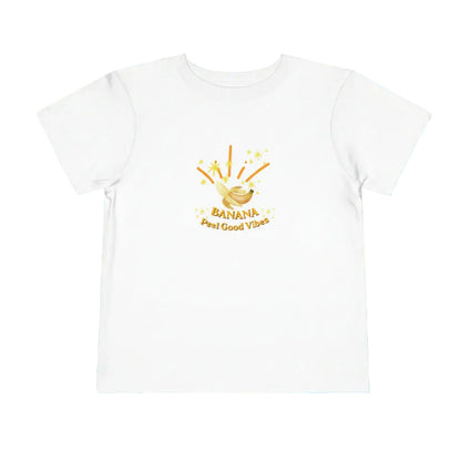 White toddler T-shirt with a cartoon-style banana graphic and 'Peel Good Vibes' text on a white background.
