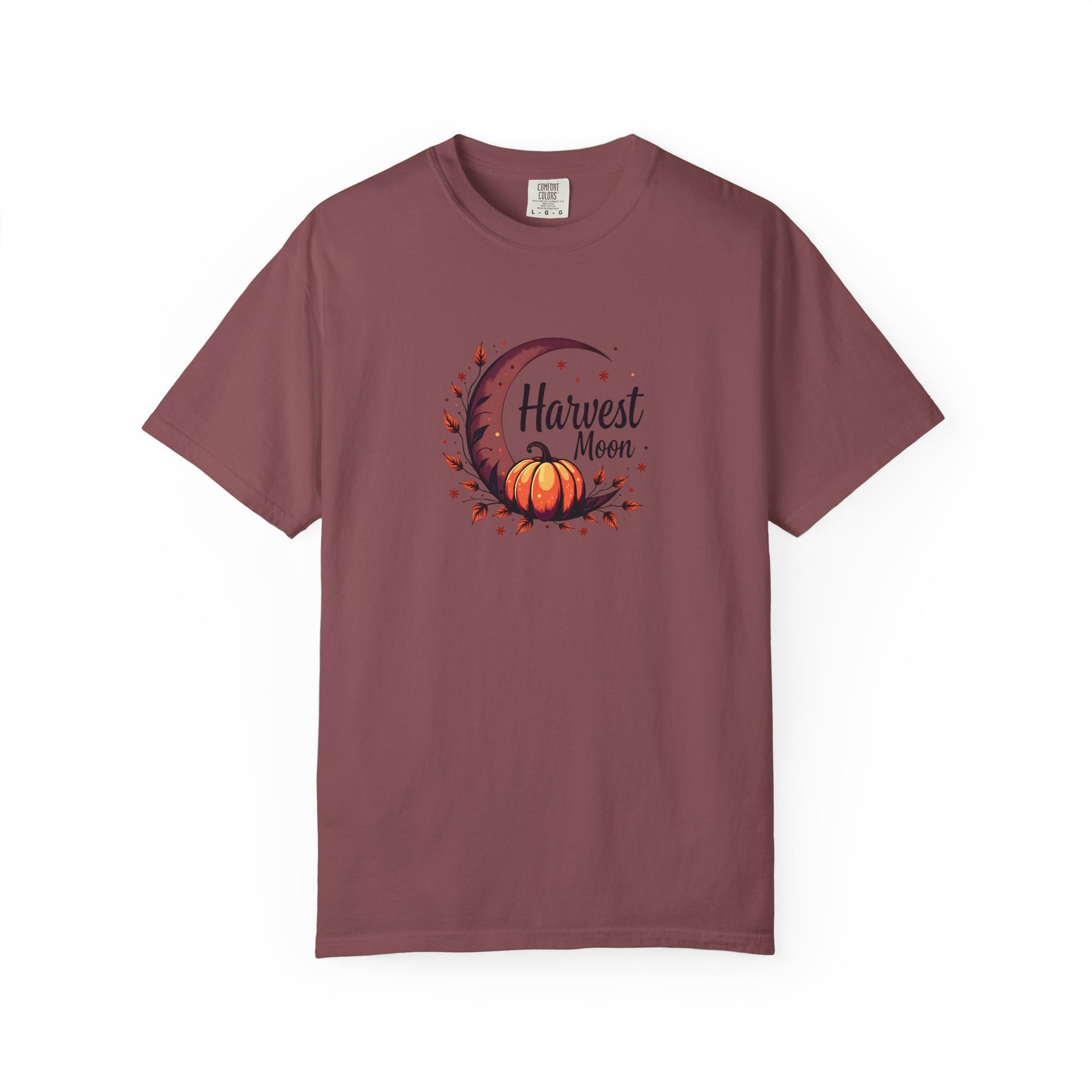 An expresso short-sleeve crewneck t-shirt featuring a central graphic of a crescent moon, autumn leaves, a pumpkin, and the text 'Harvest Moon' in black script.