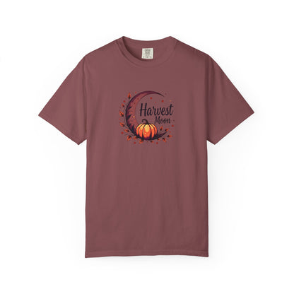 An expresso short-sleeve crewneck t-shirt featuring a central graphic of a crescent moon, autumn leaves, a pumpkin, and the text 'Harvest Moon' in black script.