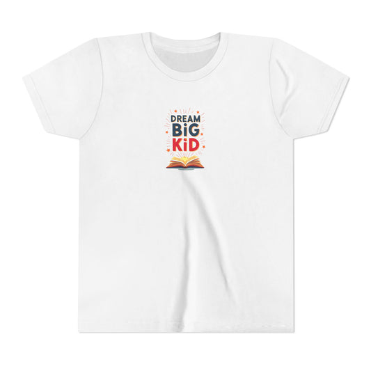White t-shirt with the image of a book. Text reads "Dream Big Kid"