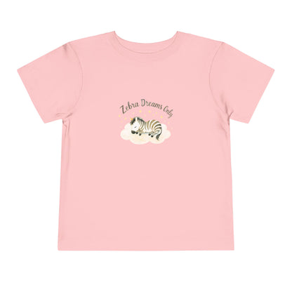 Pink t-shirt with a zebra graphic and text on a white background. Toddler t-shirt with a sleeping watercolor zebra curled on a cloud and text reading ‘Zebra Dreams.’ Not intended for sleepwear.