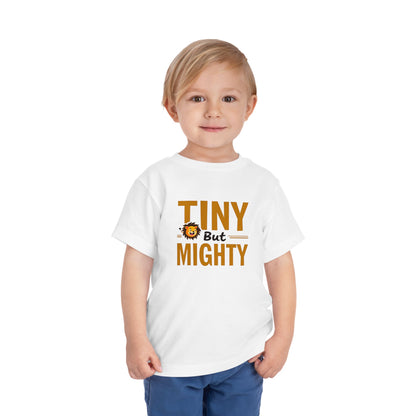 Child wearing a white t-shirt with 'Tiny But Mighty' text and a lion graphic on a white background. AI model