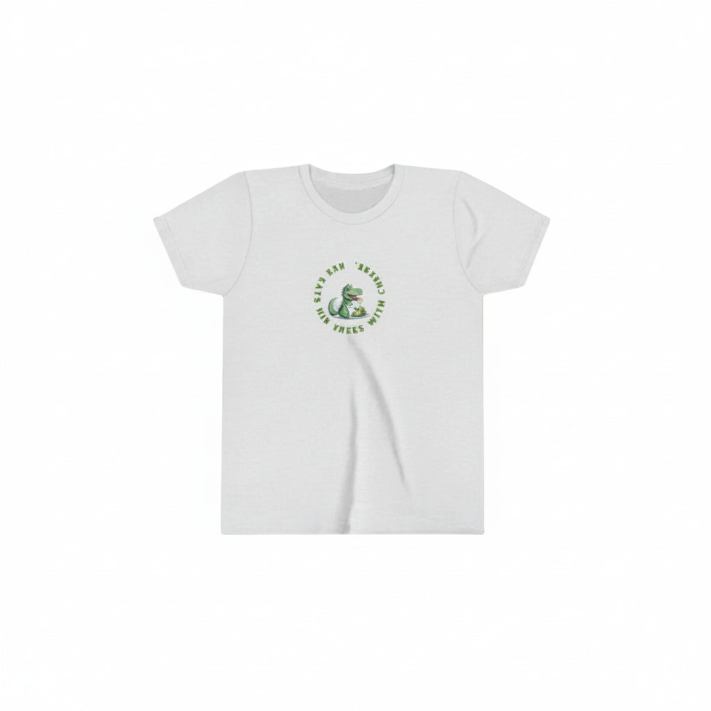 A light heather gray short-sleeve t-shirt with a circular green graphic on the chest featuring a cartoon dinosaur or alligator and the text reads "Rex eats his tree with cheese."
