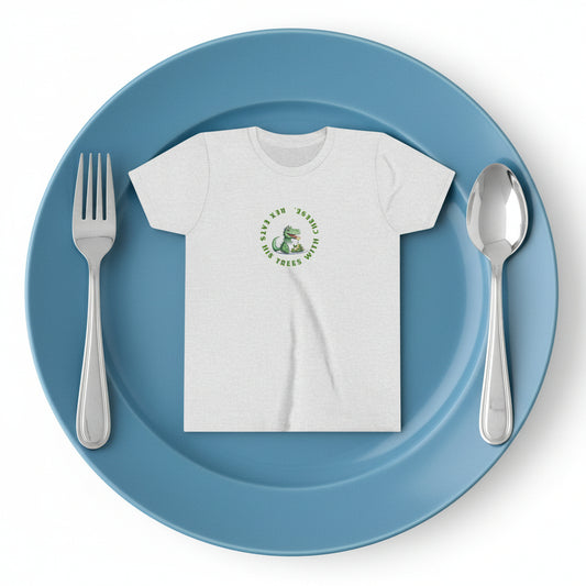 A light heather gray short-sleeve t-shirt with a circular green graphic on the chest featuring a cartoon dinosaur or alligator and the text reads "Rex eats his tree with cheese."