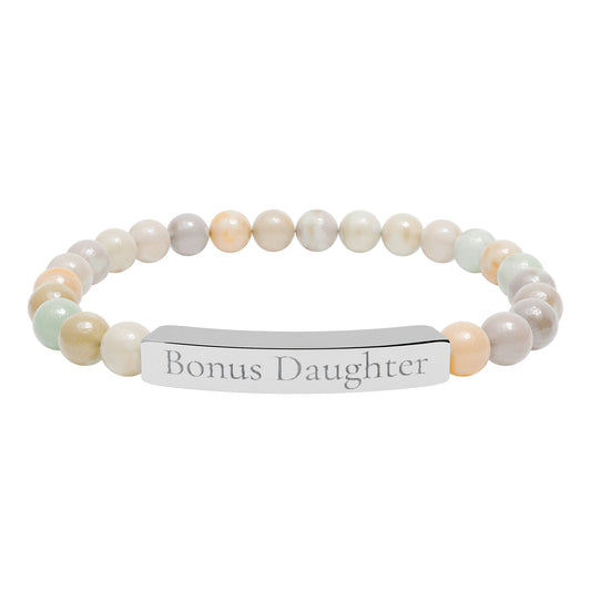 Beaded bracelet with a metal tag displaying 'Bonus Daughter' on a white background
