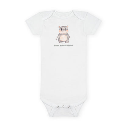White baby onesie with a cartoon hippo design and text on a white background