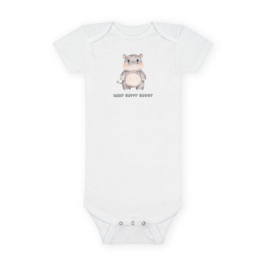 White baby onesie with a cartoon hippo design and text on a white background