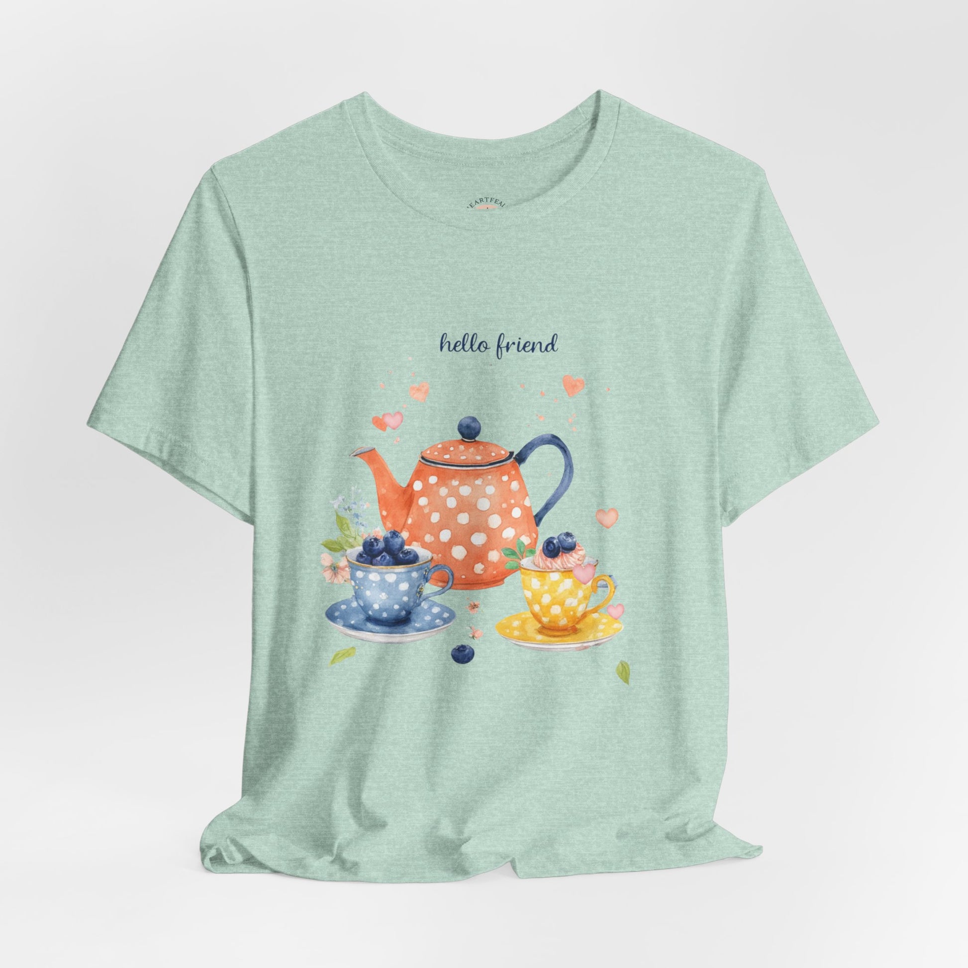 Light green t-shirt with a tea-themed graphic and 'hello friend' text on a white background