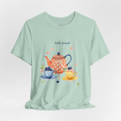 Light green t-shirt with a tea-themed graphic and 'hello friend' text on a white background