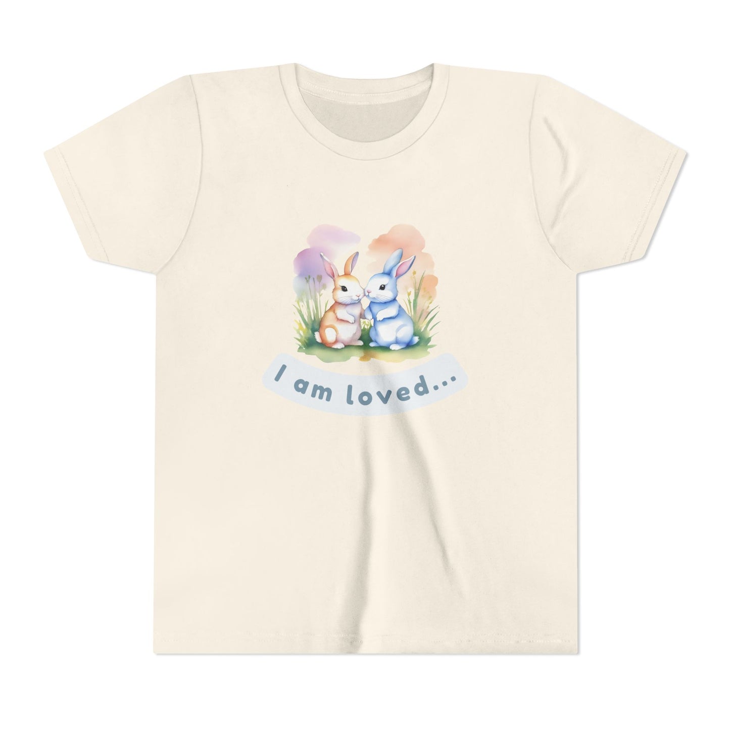 Beige t-shirt with cartoon bunnies and 'I am loved' text on a white background