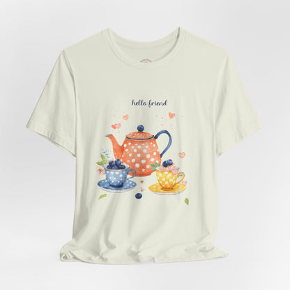 White t-shirt with a tea-themed graphic and 'hello friend' text on a light gray background