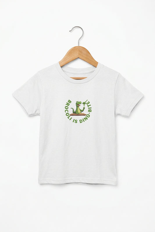 Ash grey t-shirt with a dinosaur eating broccoli. A circle of words reads "Broccoli is Dino-bite." on a wooden hange.