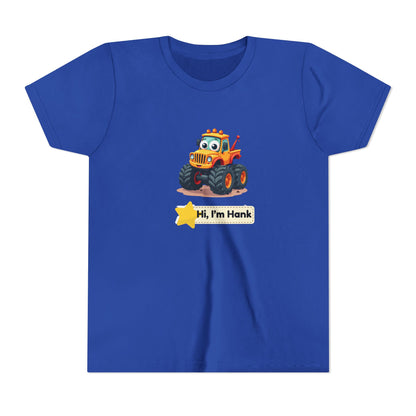 A royal blue short-sleeve crewneck t-shirt featuring a cartoon graphic of a cheerful yellow/ orange monster tires truck with a smiling face and the text 'Hi, I'm Hank' on a yellow star banner below it.