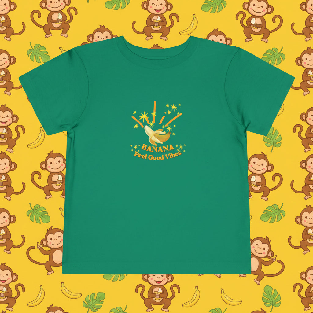 A cute “Banana Peel Good Vibes” graphic tee featuring a smiling banana character inspired by Anna Banana Baker.