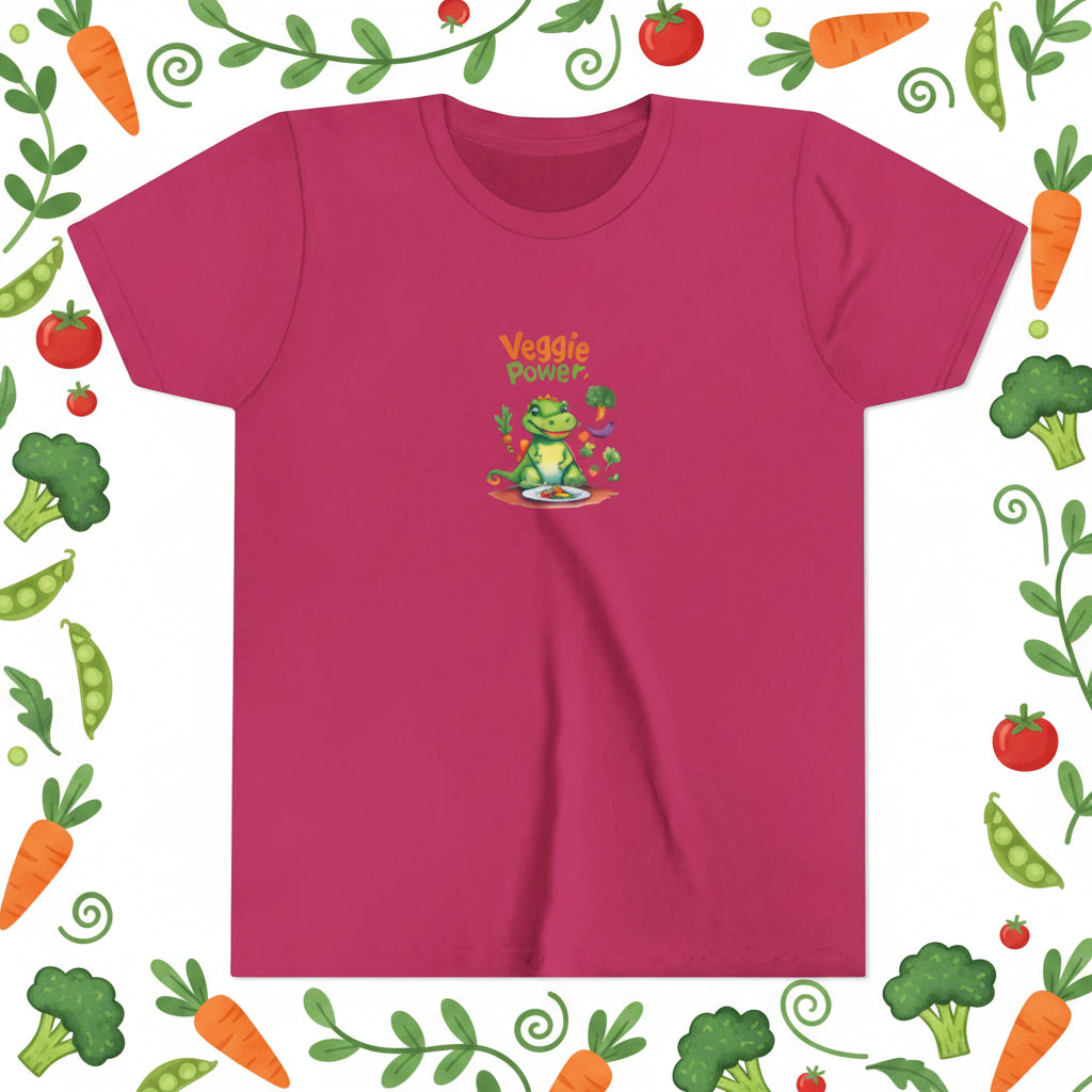 Veggie Power written on a berry pink t-shirt. Graphic of an aligator sitting at a table with a plate of veggies.