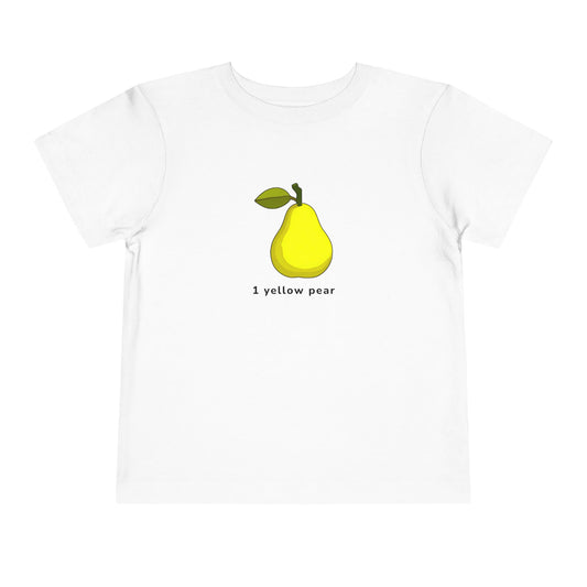 A white short-sleeve crewneck t-shirt featuring a graphic of a yellow pear with a green stem and leaf, with the text '1 yellow pear' printed underneath.
