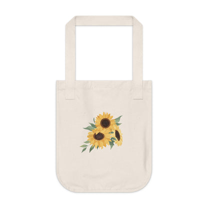 Natural beige tote bag with artistic sunflower design on a white background