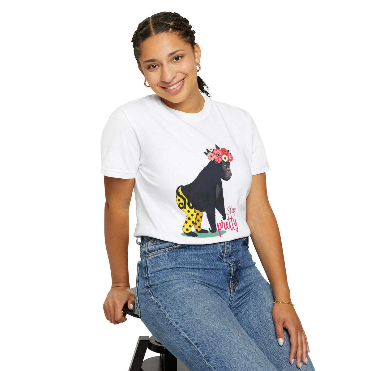 AI model wears tee. “Girl‑Girl™ gorilla wearing a flower crown and patterned shorts on a white unisex tee with the phrase ‘Stay Pretty.’”