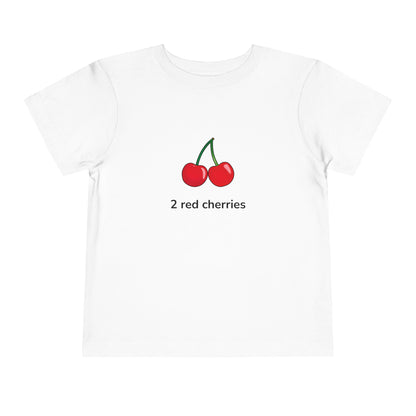 A white short-sleeve crewneck t-shirt featuring a graphic of two red cherries with green stems and the text '2 red cherries' printed below, displayed on a clean white background.